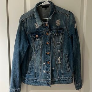 Mid length distressed denim jacket